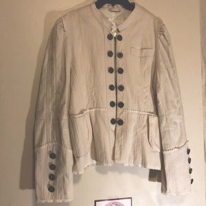 Cream colored jacket with buttons and white lace details
